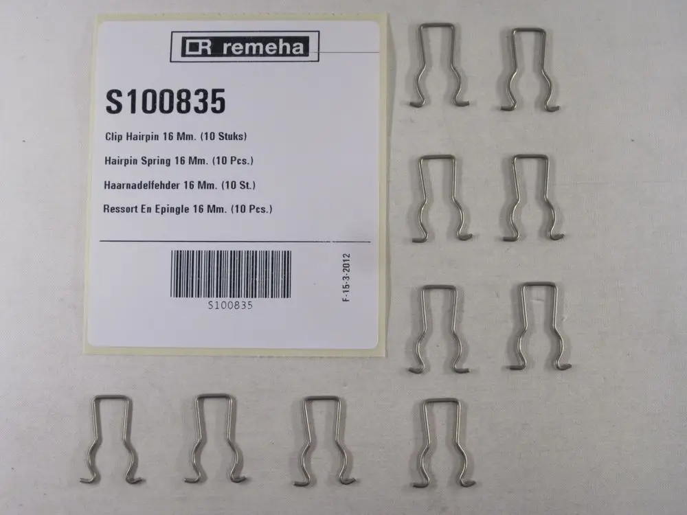 Remeha Produktpackung mit zehn Metallhaarnadelfehdern in einer organisierten Anordnung auf hellem Hintergrund.